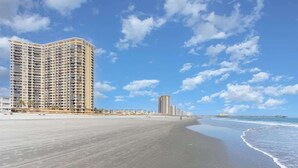 A beachfront hotel with a large building, a pier, and a sandy beach. - Newly Added Maisons, Large Balconies - City View! (Myrtle Beach)
