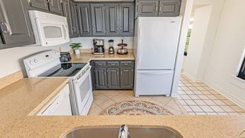 Fridge, microwave, coffee/tea maker, toaster