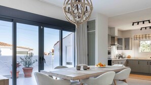 A modern kitchen with grey cabinets, a white countertop, and a built-in oven. - Villa Hope -Luxury 3-bedroom villa with AC, WiFi in lovely Buenas Noches (Buenas Noches)