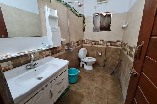 Double Room, City View | Bathroom | Shower, free toiletries, slippers, toilet paper