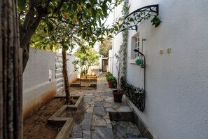 Stroll through this serene courtyard surrounded by lush greenery and a tranquil atmosphere.