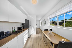 Fridge, microwave, stovetop, coffee/tea maker