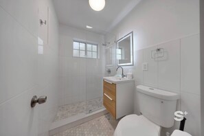 Shower, hair dryer, towels, shampoo