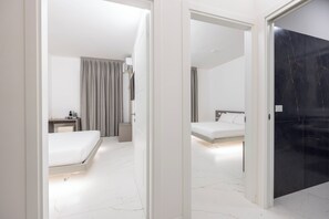 Luxury Triple Room, Private Bathroom, City View | In-room safe, desk, laptop workspace, blackout drapes