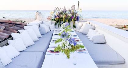 Elegant beachfront villa with jacuzzi, garden, and panoramic terrace.