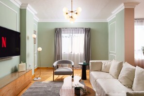 Basic Apartment | Living area | 55-inch TV with satellite channels - Xuru Stays I The 2 BDR Sterling Residence 5 min to CAI Airport (Cairo)