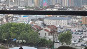 A cityscape with modern skyscrapers, including a tower with a spherical observation deck. - ZHome-Sun Garden-Amazing view (Shanghai)