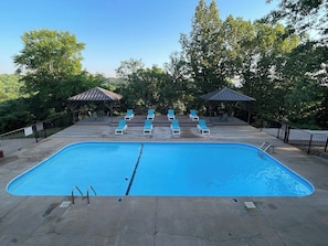 Our first pool has plenty of seating for the family along with BBQ pits at the pavilion. - Rustic Ozark Retreat (First Responder Owner) (Reeds Spring)