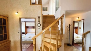 A staircase with wooden balusters leading to a second floor. - Apartman Talia 1 (Dramalj)