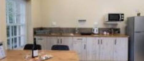 Fridge, microwave, cookware/dishes/utensils