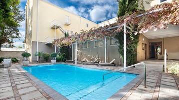 Outdoor pool, pool umbrellas, pool loungers