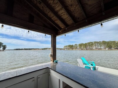  Spacious 7-bedroom, 5-bath home on 168' of a wide, deep-water cove.