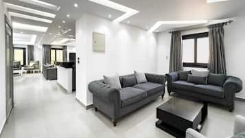 Apartamento básico | Área de estar | Smart TV 55 polegadas com canais via satélite