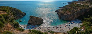 A coastal beach with rocky terrain and clear blue waters. - Stara Stone House Tranquil Garden Dazzling View (West Mani)