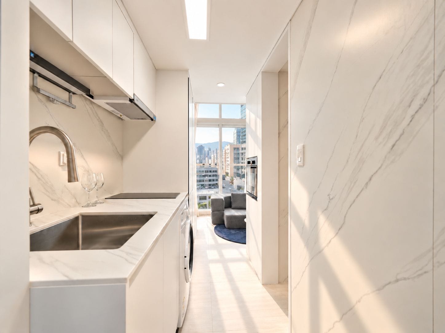 A modern kitchen with a built-in oven and a view of the cityscape through large windows.