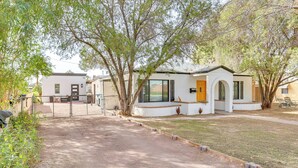 A residential area with a modern house featuring a large window, a door, and a small porch. - 4 Mi to Dtwn Phx: Couples Escape w/ Shared Patio (Phoenix)