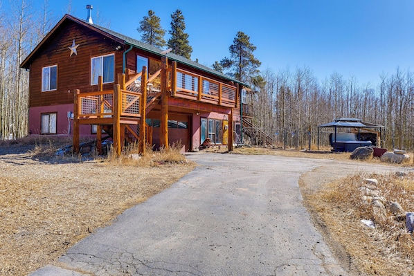 A wooden cabin with a large porch, a staircase, and a covered outdoor seating area. - Mtn-view Getaway w/ On-site Trails in Fairplay! (Fairplay)