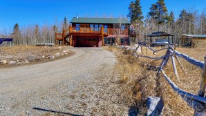 A rustic cabin with a large deck and a garage. - Mtn-view Getaway w/ On-site Trails in Fairplay! (Fairplay)