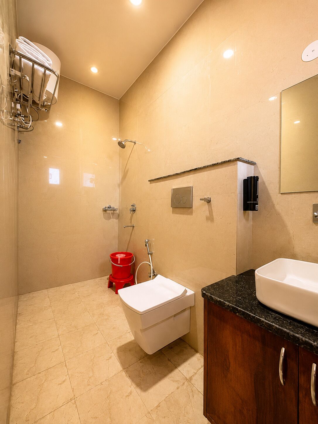 A modern bathroom with a shower, a sink, and a toilet.