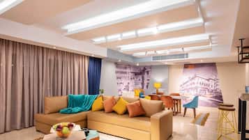 Basic Apartment | Living area | 55-inch Smart TV with satellite channels, streaming services
