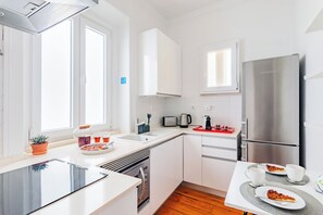 Enjoy cooking in this well-equipped kitchen with a refrigerator, oven, and dishwasher.