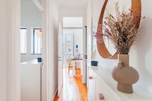 Stunning hallway leads to a beautifully set dining area with a table for two.