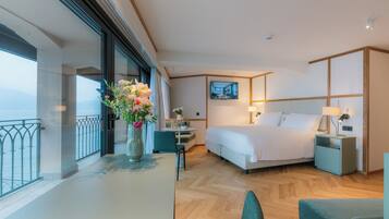 Junior Suite, Balcony, Lake View | Minibar, in-room safe, desk, blackout drapes