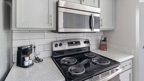 Fridge, dining tables - Landing | Modern 2BD, Pool, Gym (Houston)