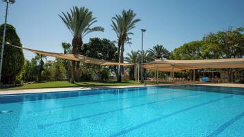 Seasonal outdoor pool, pool umbrellas, pool loungers