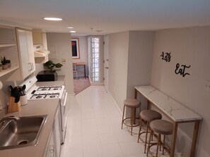 Fridge, microwave, oven, stovetop - Spacious English Basement Retreat in Adams Morgan - Steps to Nightlife and Dining (Washington)