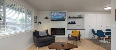 Cozy living space with Smart TV and fireplace