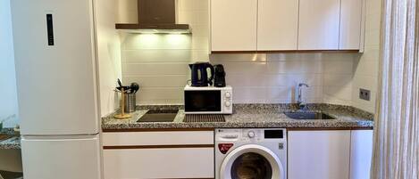 Fridge, microwave, stovetop, coffee/tea maker