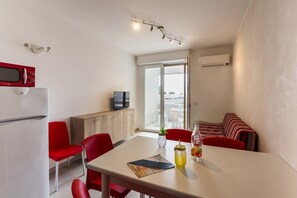 Apartment, 1 Bedroom, Balcony | Dining room - Bright Flat Near the Beach in Bibione (San Michele al Tagliamento)