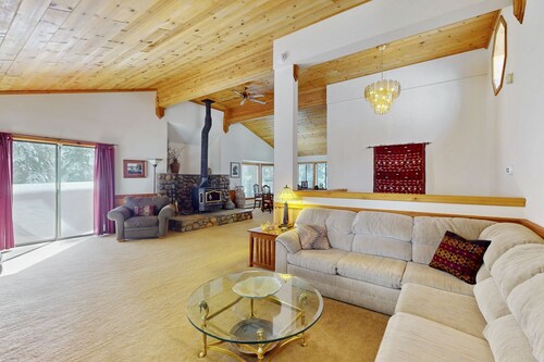 Rustic home with wood stove, deck, open floor plan, & nearby activities