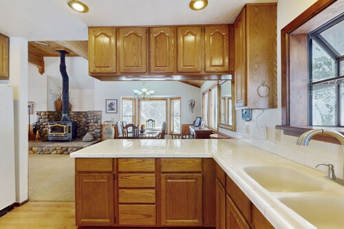 Rustic home with wood stove, deck, open floor plan, & nearby activities