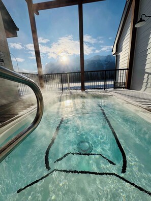 Relax by the pool surrounded by a mountain view.