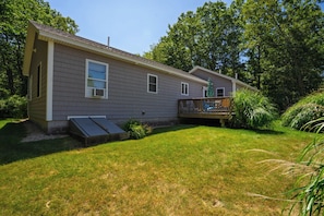 A single-story house with a front deck and a ramp leading to the entrance. - Single Level 4BR Pet-Friendly Home (Kennebunkport)