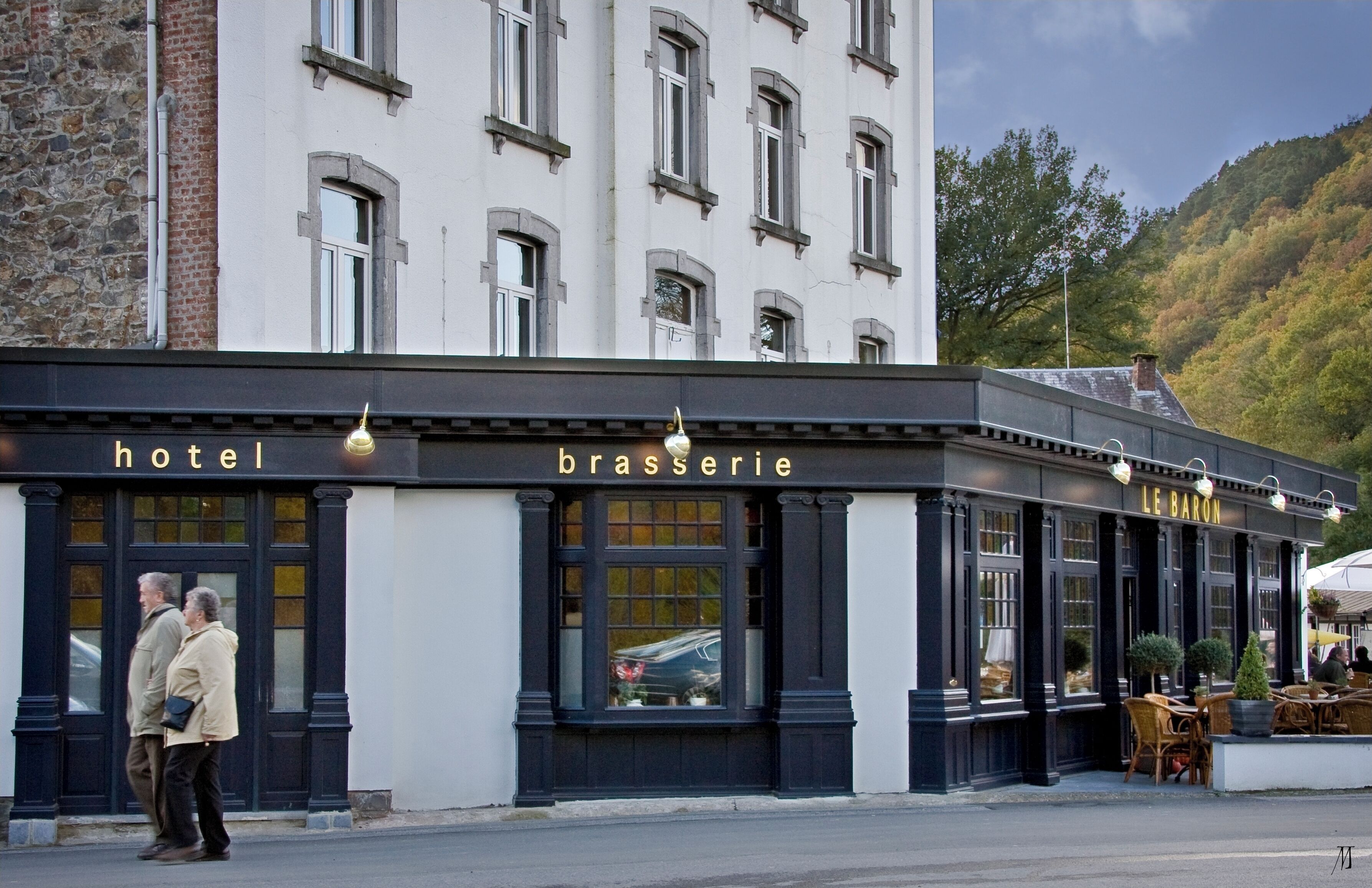 A hotel with a brasserie and bar named "Le Baron" on the ground floor.