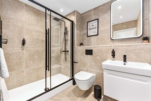 Shower, hair dryer, towels