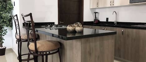 Fridge, coffee/tea maker, cookware/dishes/utensils