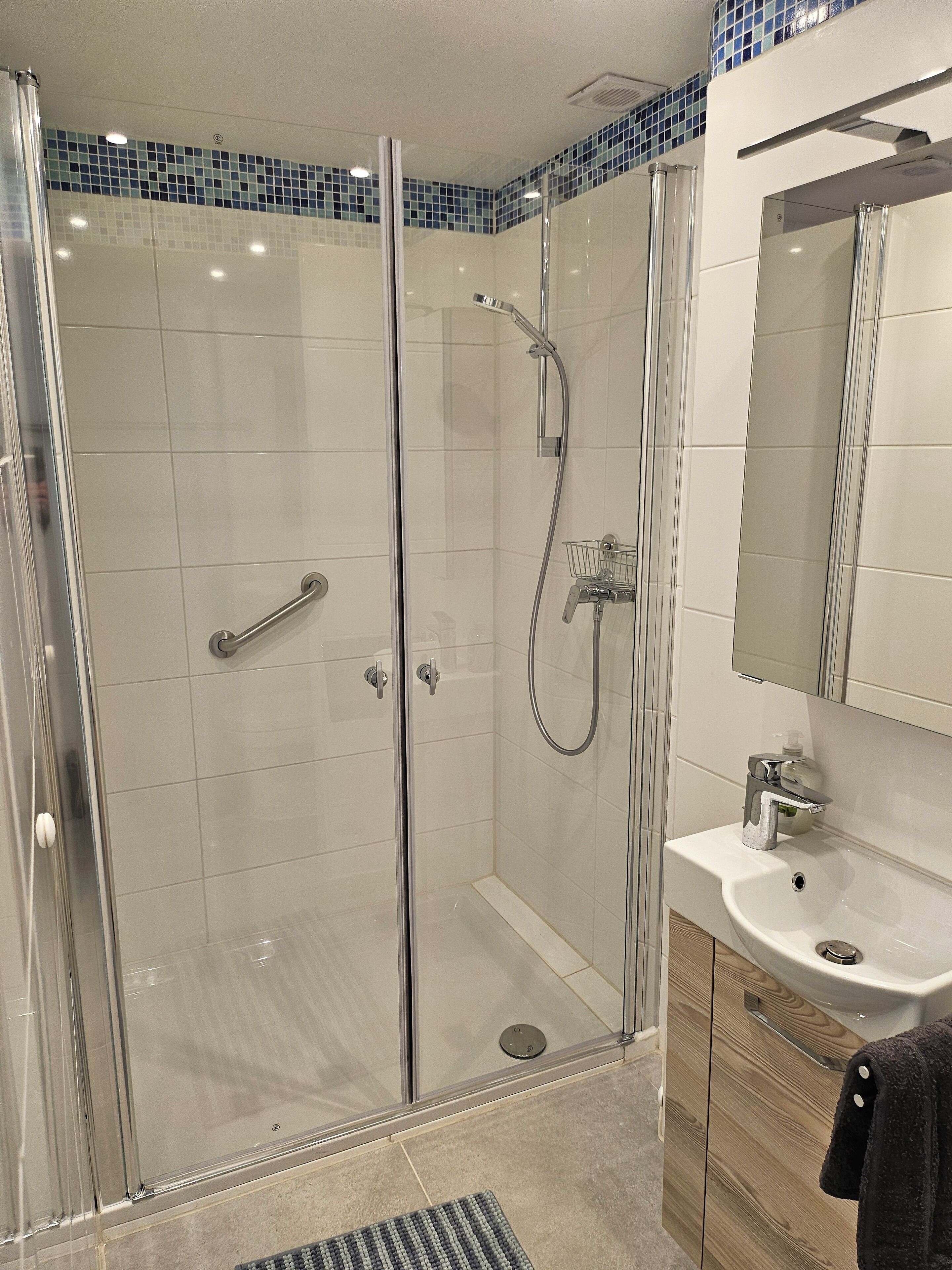 Shower, hair dryer, towels, soap
