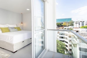 Relax in a spacious room with a large bed and city views.