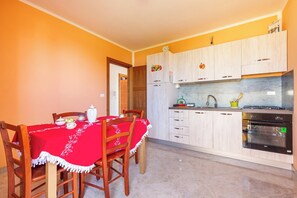 Fridge, microwave, stovetop, cookware/dishes/utensils