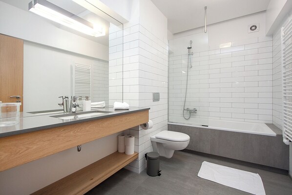 Shower, hair dryer, towels, toilet paper