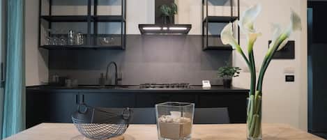 Fridge, microwave, stovetop, cookware/dishes/utensils