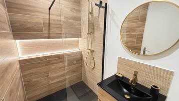 Shower, hair dryer, towels, soap