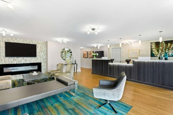 Step into a bright lobby with sleek, welcoming service.