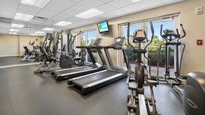 A gym with multiple treadmills, elliptical machines, and weight equipment. - Miramar Beach Studio w/ Pool, Tennis & Walk to Beach Luau Eastern Sky (Miramar Beach)