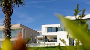 A modern building with large windows and a flat roof.