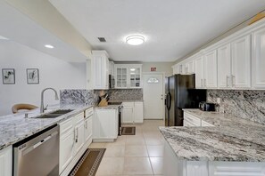 Fridge, microwave, oven, stovetop - Spacious & Modern Retreat -Patio Bar • Large Yard • Parking (Port St. Lucie)